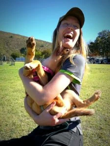 Nancy playing with a dog
